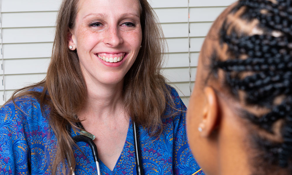 Dr Kristen Withey consulting with patient