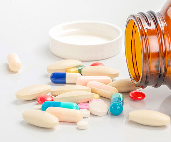 Medicine and bottle on white background